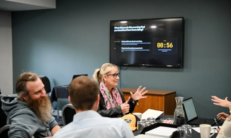 A delegate sharing her answer during a timed exercise